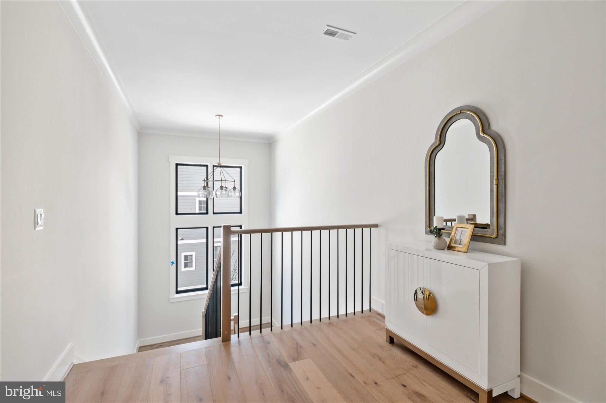 6928 Whitehall Place McLean, VA 22101 - Photo 49 of 77 a view of a hallway with entryway wooden floor and front door