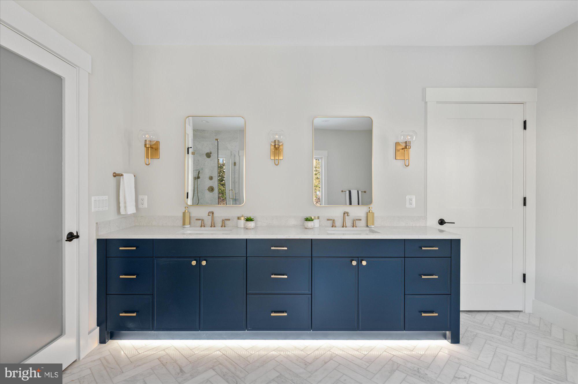 6928 Whitehall Place McLean, VA 22101 - Photo 55 of 77 a spacious bathroom with double vanity and a mirror
