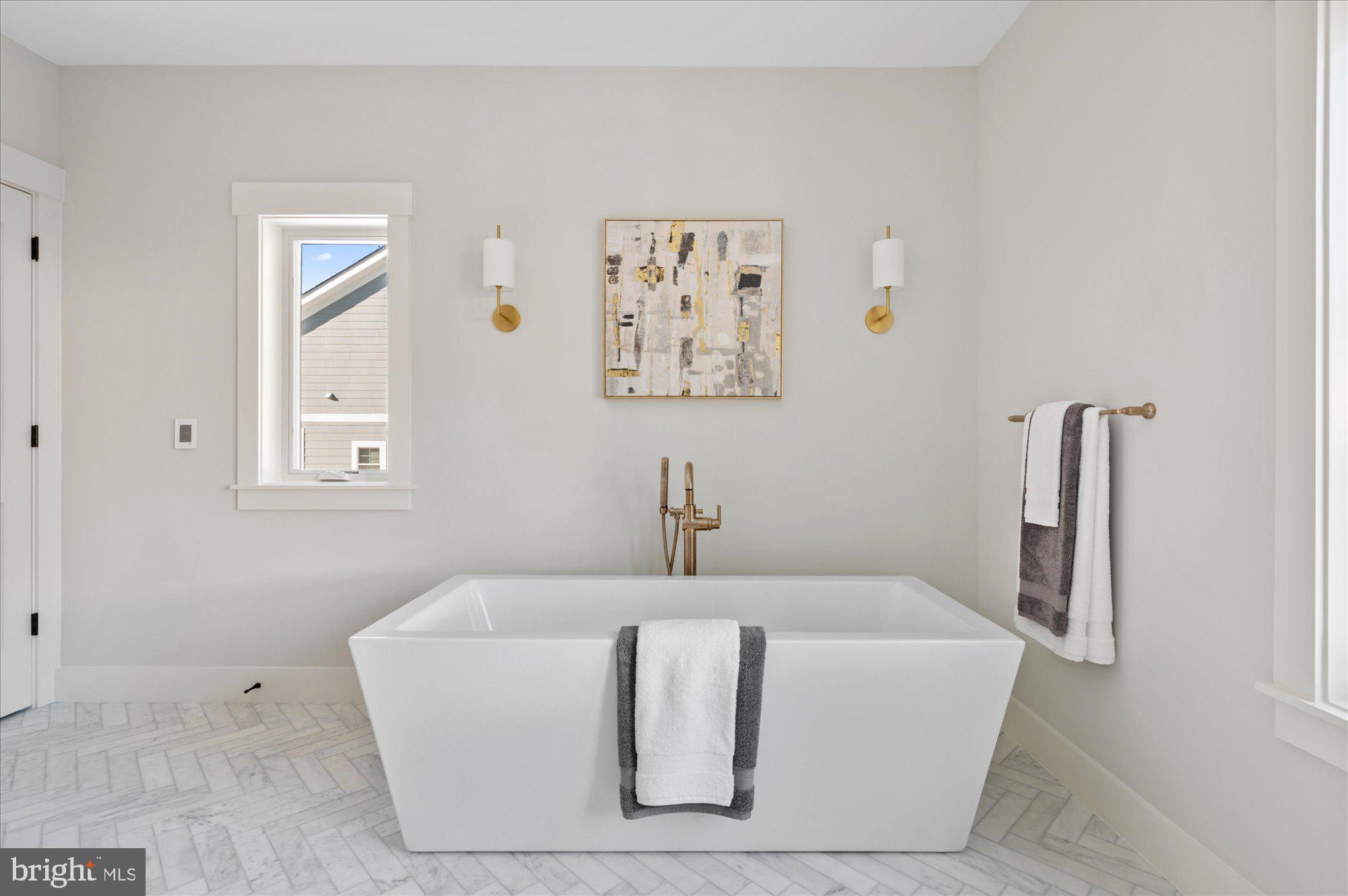 6928 Whitehall Place McLean, VA 22101 - Photo 59 of 77 a white bath tub sitting in a bathroom