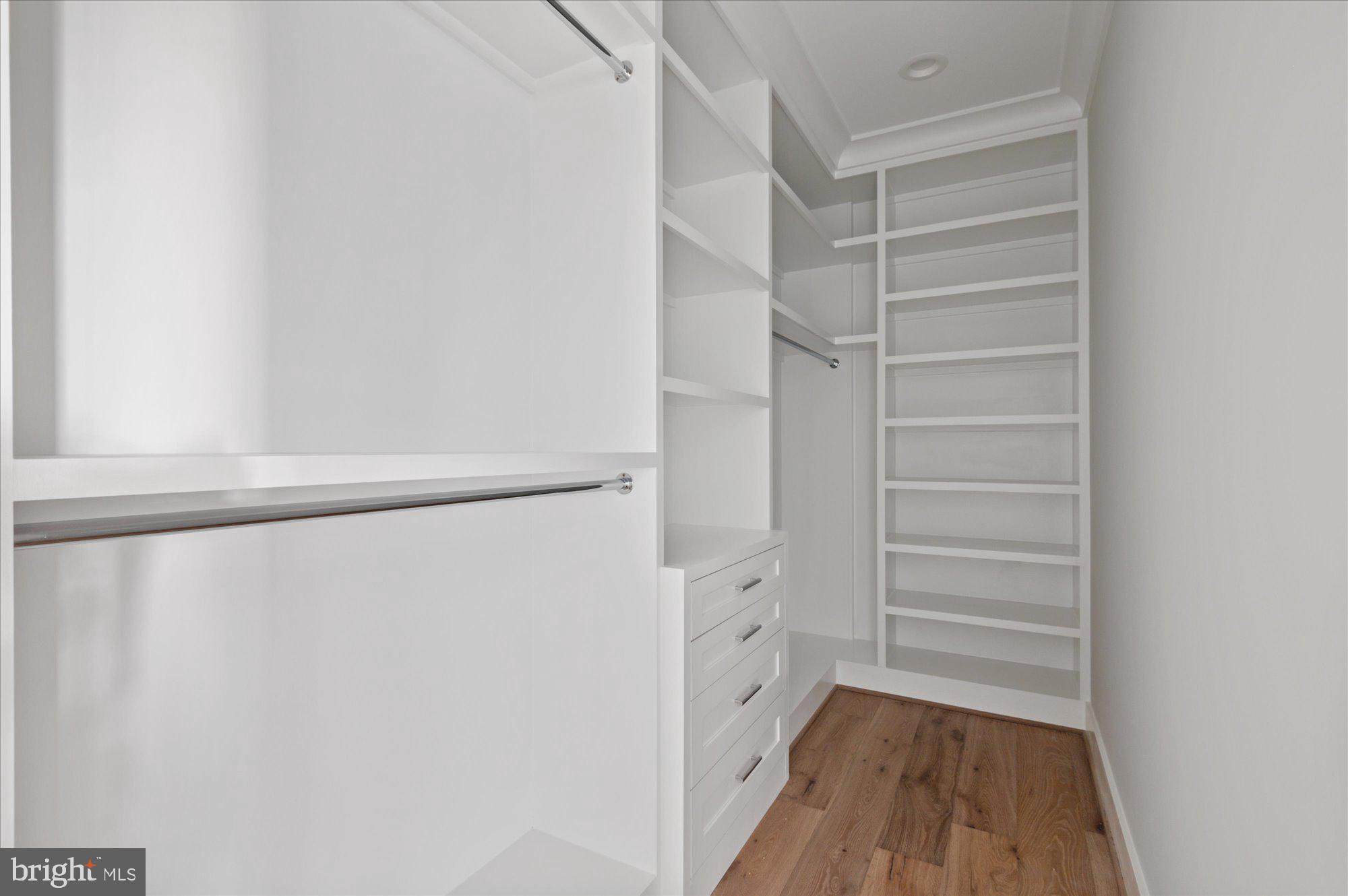 6928 Whitehall Place McLean, VA 22101 - Photo 61 of 77 a view of walk in closet with empty racks