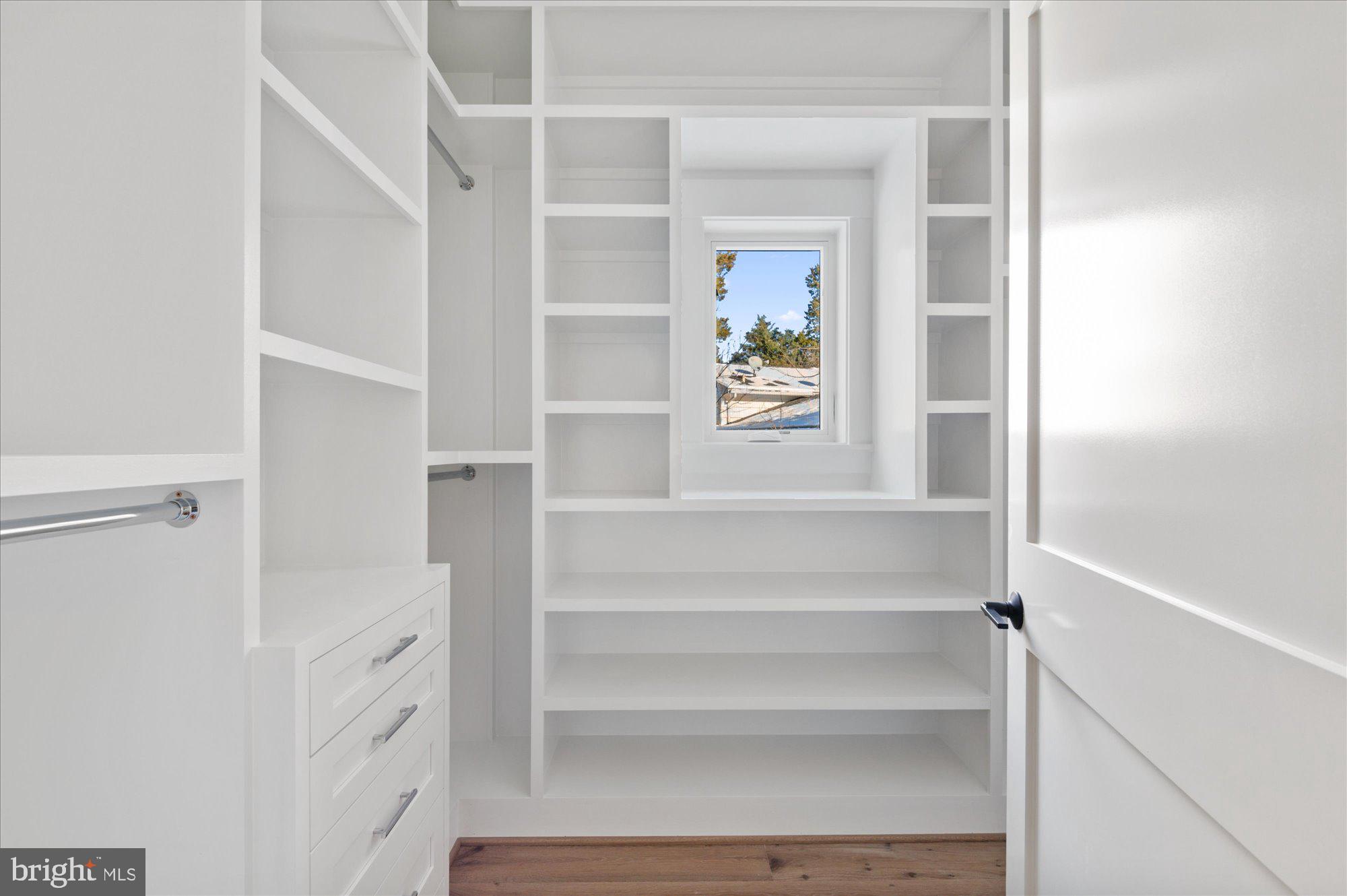 6928 Whitehall Place McLean, VA 22101 - Photo 62 of 77 a view of walk in closet with empty racks