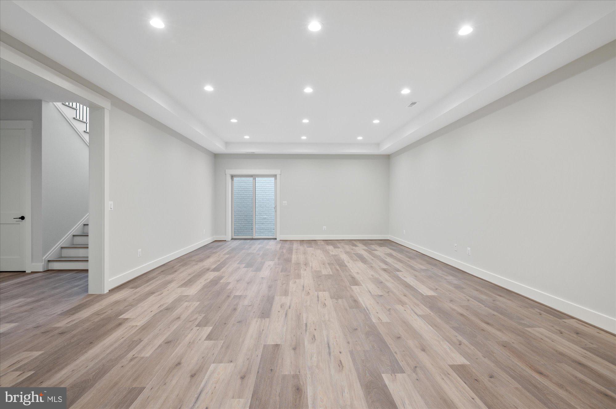 6928 Whitehall Place McLean, VA 22101 - Photo 67 of 77 a view of empty room with wooden floor