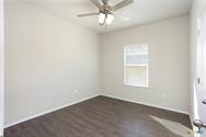 3430 Scott Circle Seguin, TX 78155 - Photo 8 of 11 Unfurnished bedroom featuring dark wood-type flooring, ceiling fan, and a closet