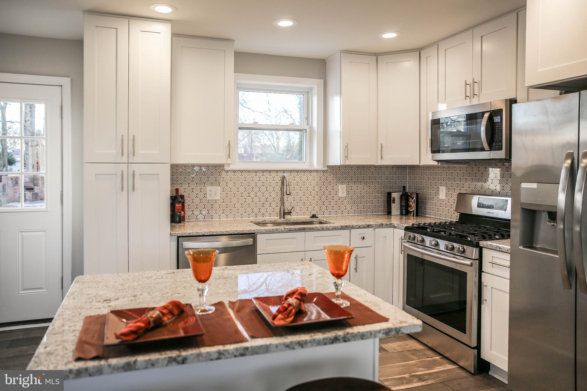 5703 Kirby Road Clinton, MD 20735 - Photo 5 of 38 Gorgeous Tall White Cabinets, Exotic Granite Cntr