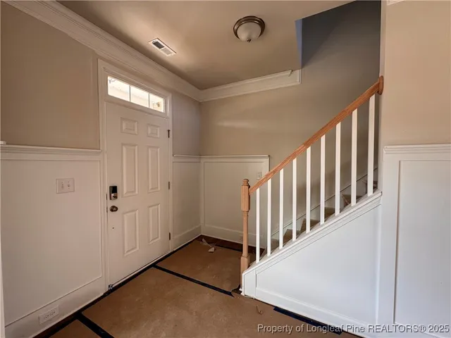 a view of a hallway with staircase
