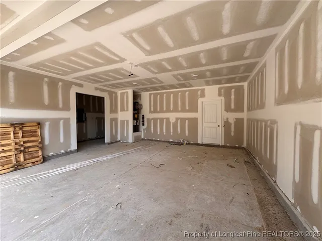 a view of an empty room with closet