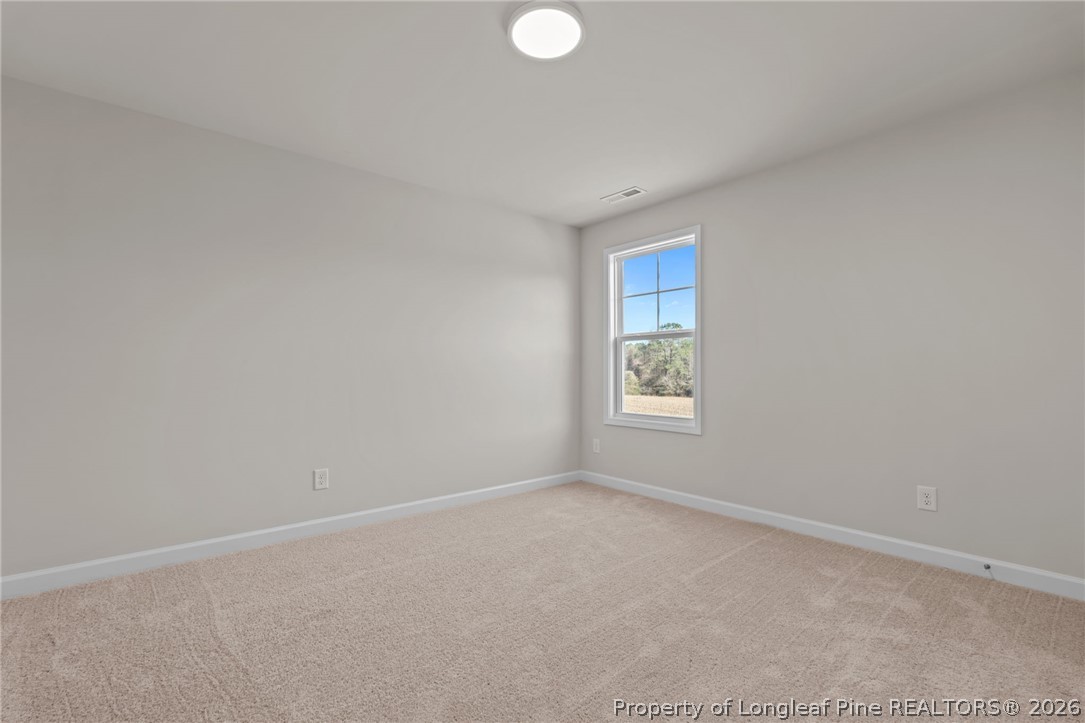 290 Elijah Way Vass, NC 28394 - Photo 33 of 45 a view of an empty room with a window