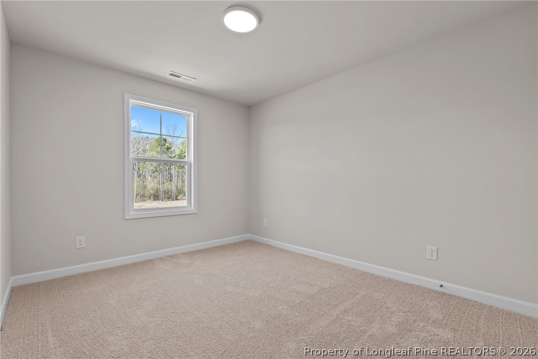 290 Elijah Way Vass, NC 28394 - Photo 35 of 45 an empty room with windows