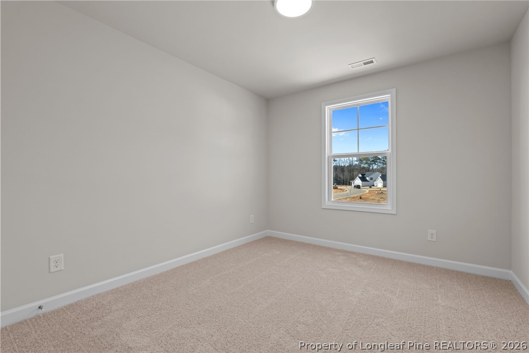 290 Elijah Way Vass, NC 28394 - Photo 36 of 45 an empty room with windows