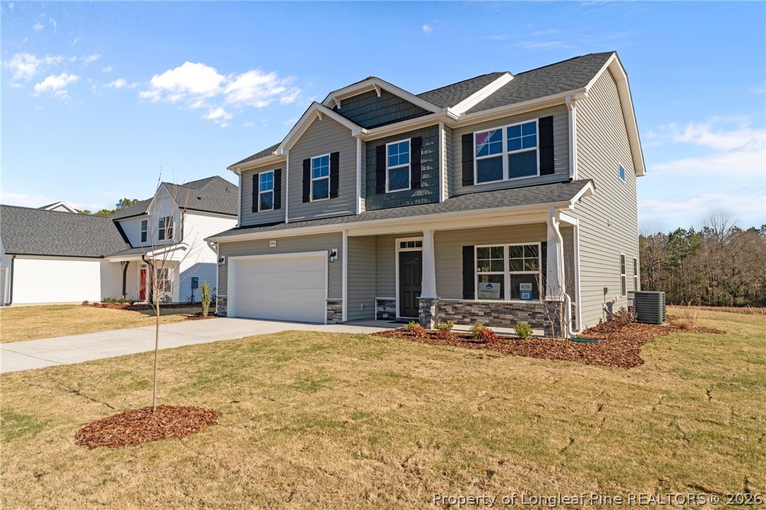 290 Elijah Way Vass, NC 28394 - Photo 4 of 45 a front view of a house with a yard