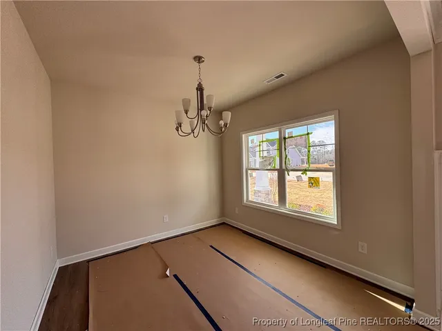 a view of empty room with windows