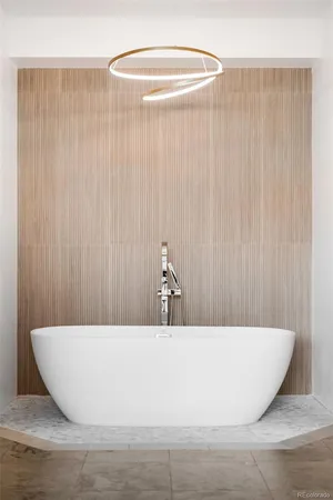 a white tub sitting next to a white wall