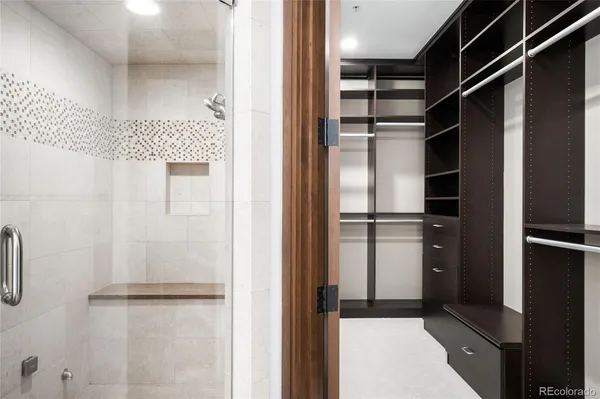 a view of walk in closet with empty racks