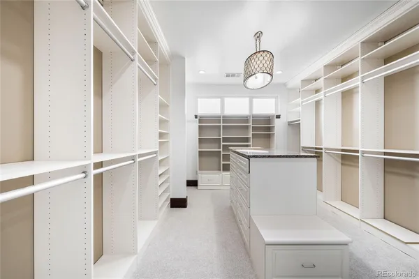 a view of storage and utility room with wooden floor