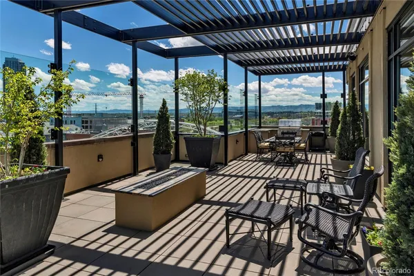 a view of swimming pool with outdoor seating