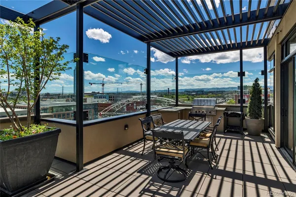 a view of a hallway with furniture and chandelier