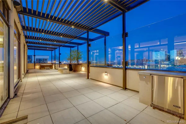 a view of a kitchen with a sink and cabinets