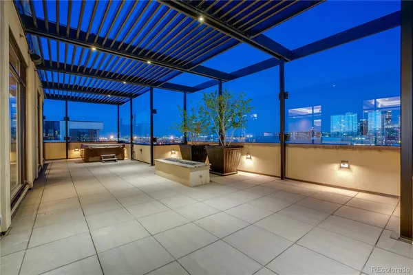 a large kitchen with kitchen island granite countertop wooden cabinets a oven and a counter top space