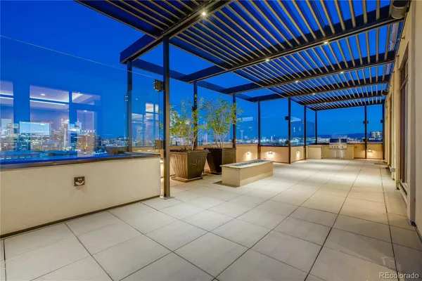 a large kitchen with stainless steel appliances granite countertop a stove and cabinets