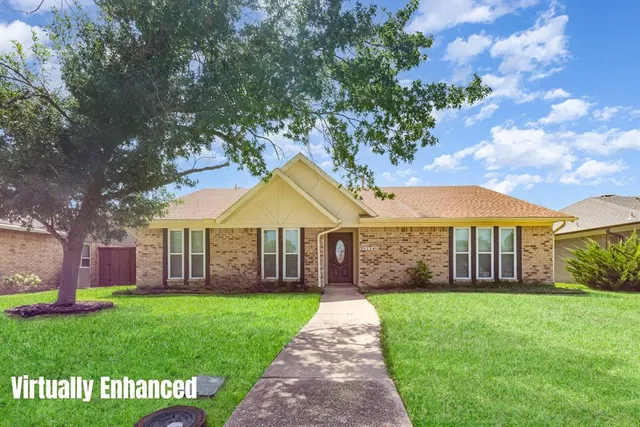 a view of a house that has a garden