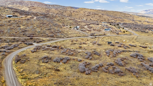 349 West Mountain View Road, Unit 349 Fairview, UT 84629 - Photo 13 of 26 Expansive rural landscape featuring a winding dirt road and scattered brush
