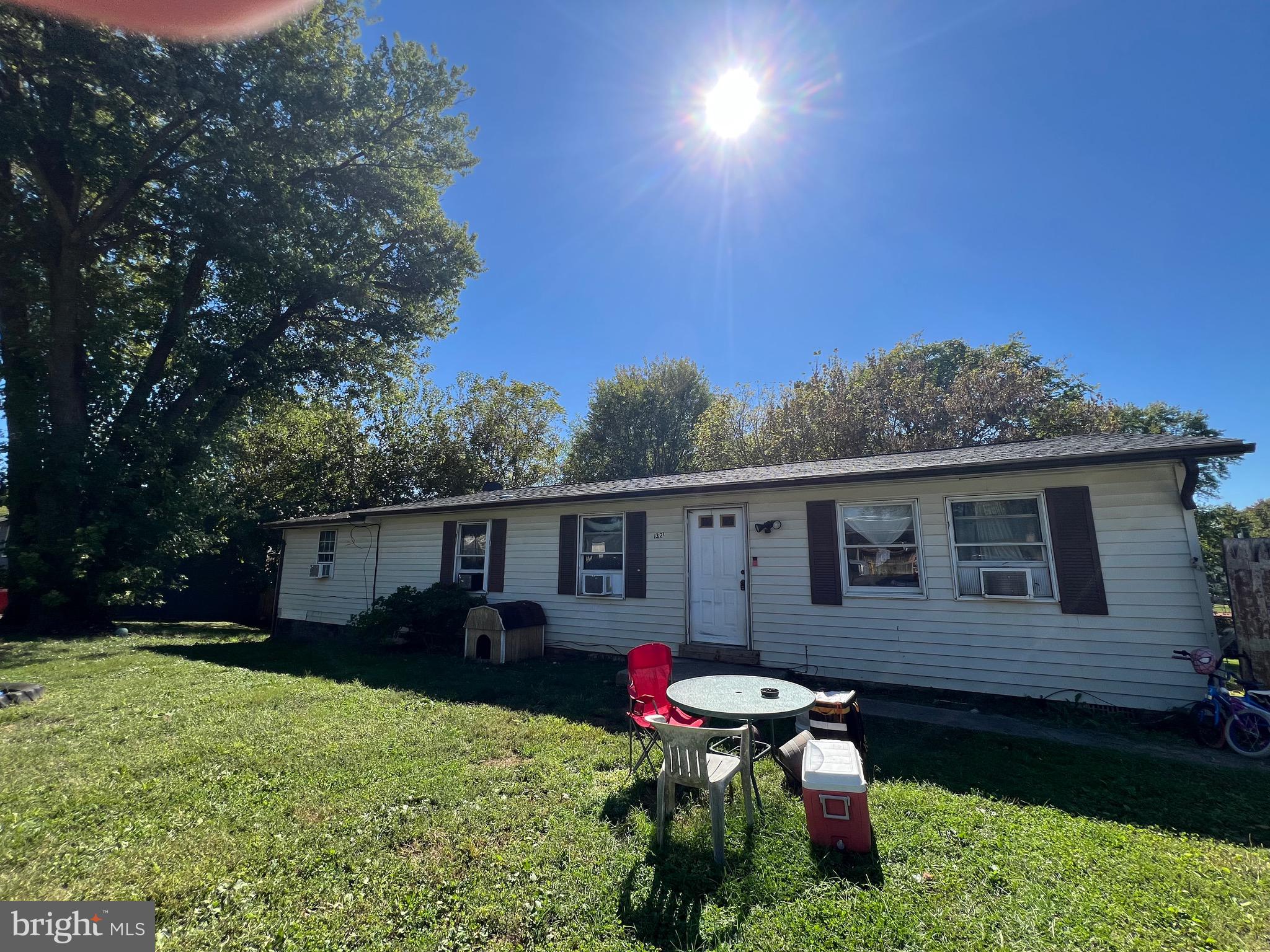 32 Anvil Road Kearneysville, WV 25430 - Photo 3 of 6 a backyard of a house with table and chairs