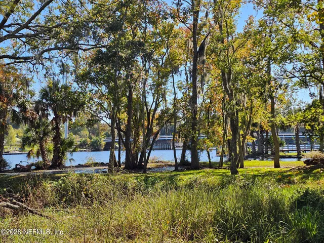 a view of swimming pool with tree s