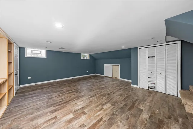 a view of an empty room with a closet