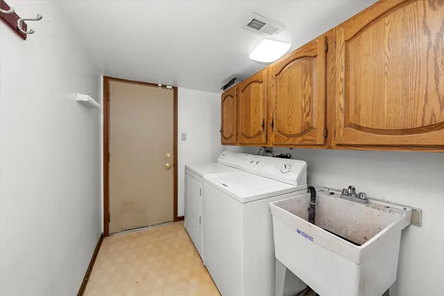 a bathroom with a granite countertop bathtub sink and mirror