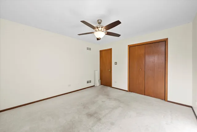 a view of an empty room with a balcony