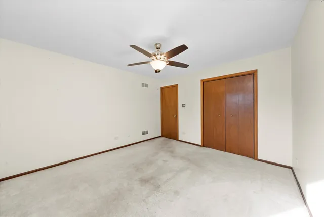 a view of a house with a yard and a garden