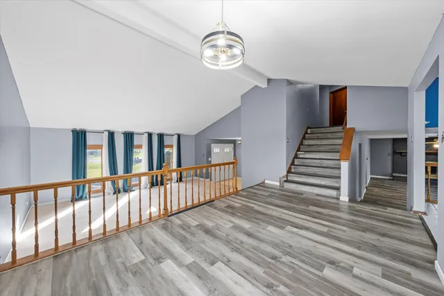 a view of a hallway with stairs