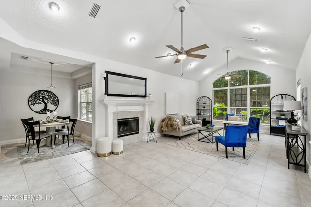 a bedroom with two beds and a large window