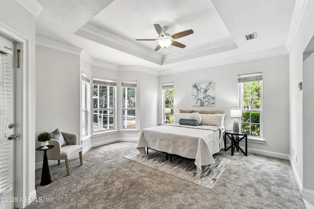 a bedroom with a bed and a walk in closet