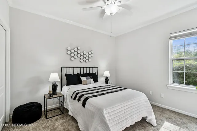 a aerial view of a house with a yard and garage
