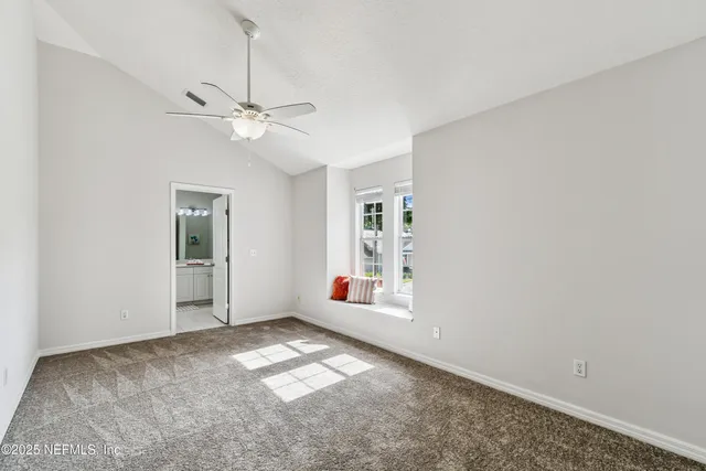 an aerial view of a house with garden space and lake view