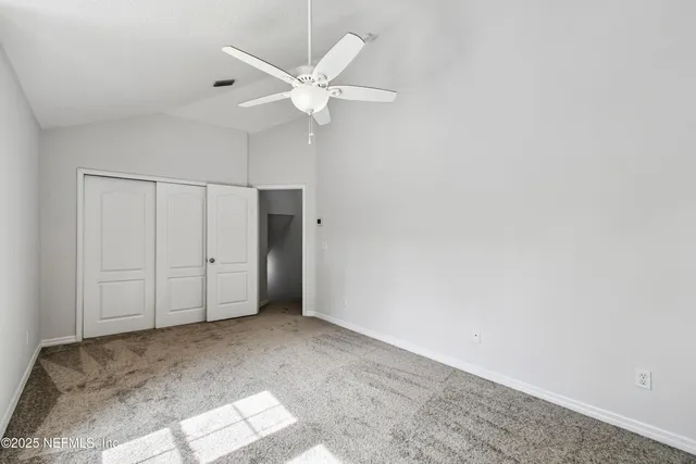 a view of swimming pool outdoor space and trees in the background