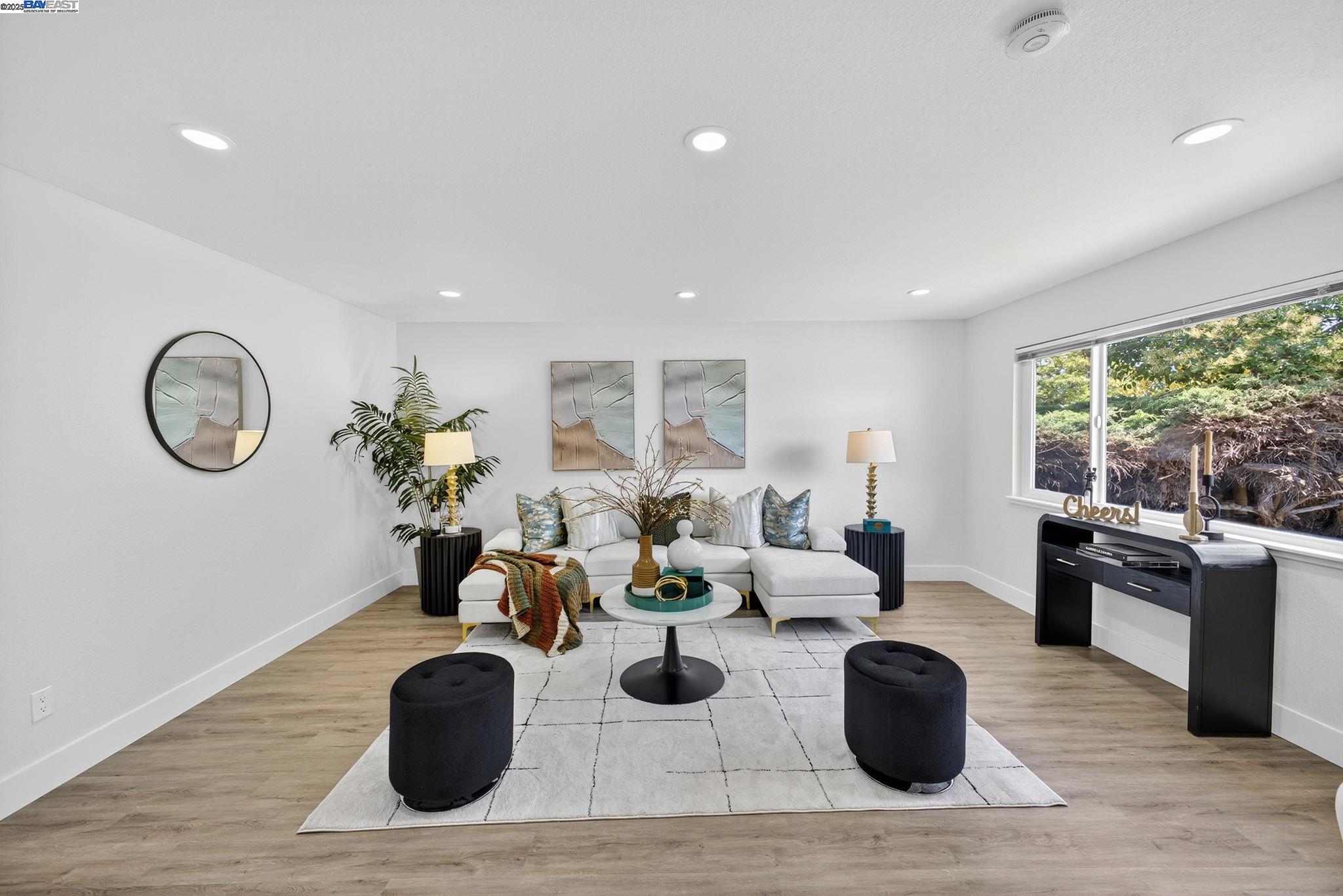 4403 Burke Way Fremont, CA 94536 - Photo 13 of 58 a living room with fireplace furniture and a large window