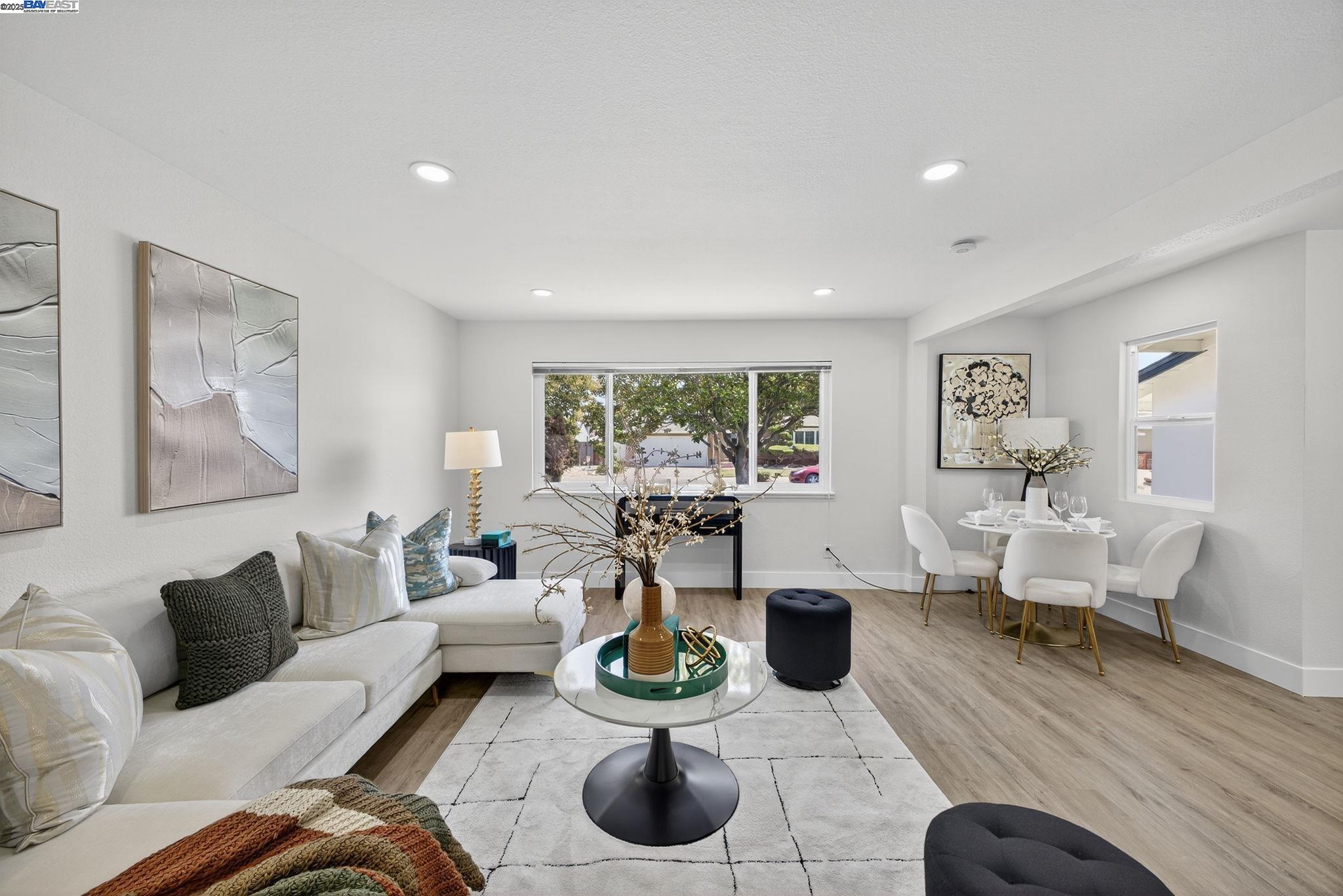 4403 Burke Way Fremont, CA 94536 - Photo 14 of 58 a living room with furniture and a wooden floor