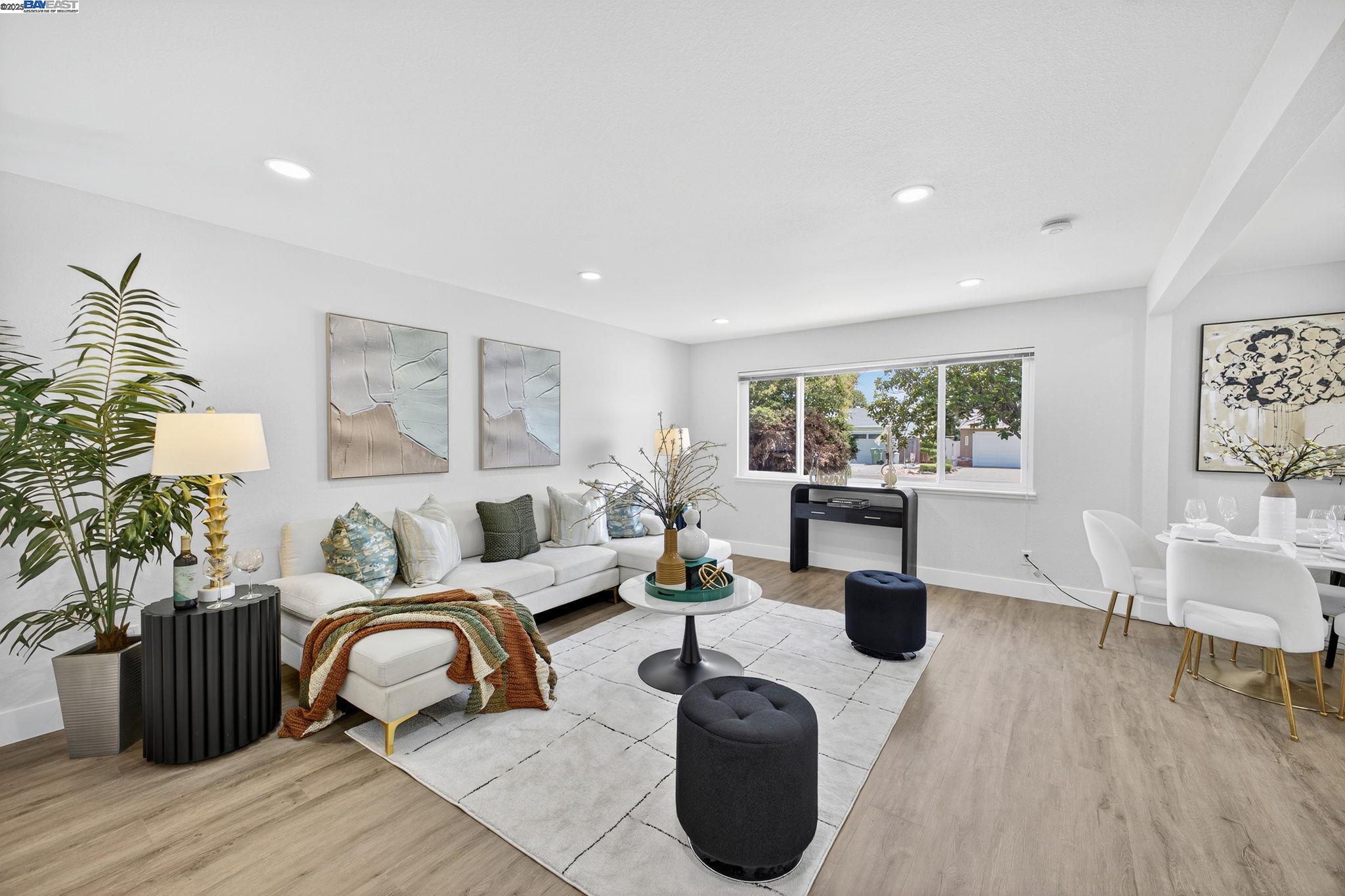 4403 Burke Way Fremont, CA 94536 - Photo 15 of 58 a living room with furniture a large window and wooden floor