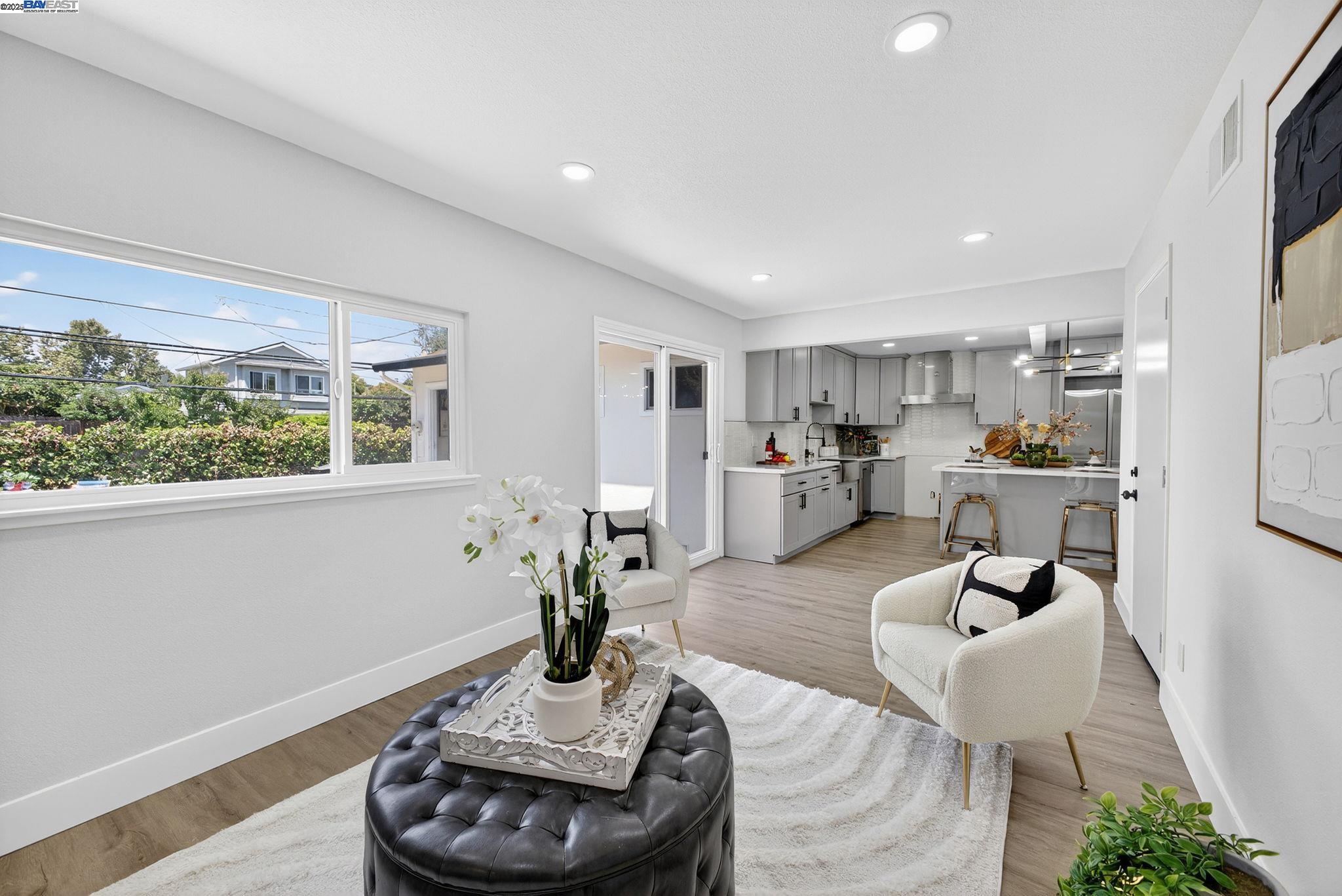 4403 Burke Way Fremont, CA 94536 - Photo 19 of 58 a living room with furniture and a potted plant