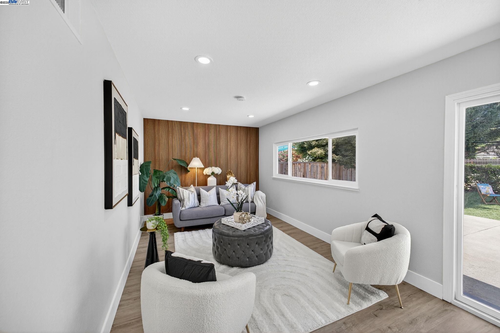 4403 Burke Way Fremont, CA 94536 - Photo 20 of 58 a living room with furniture and a potted plant