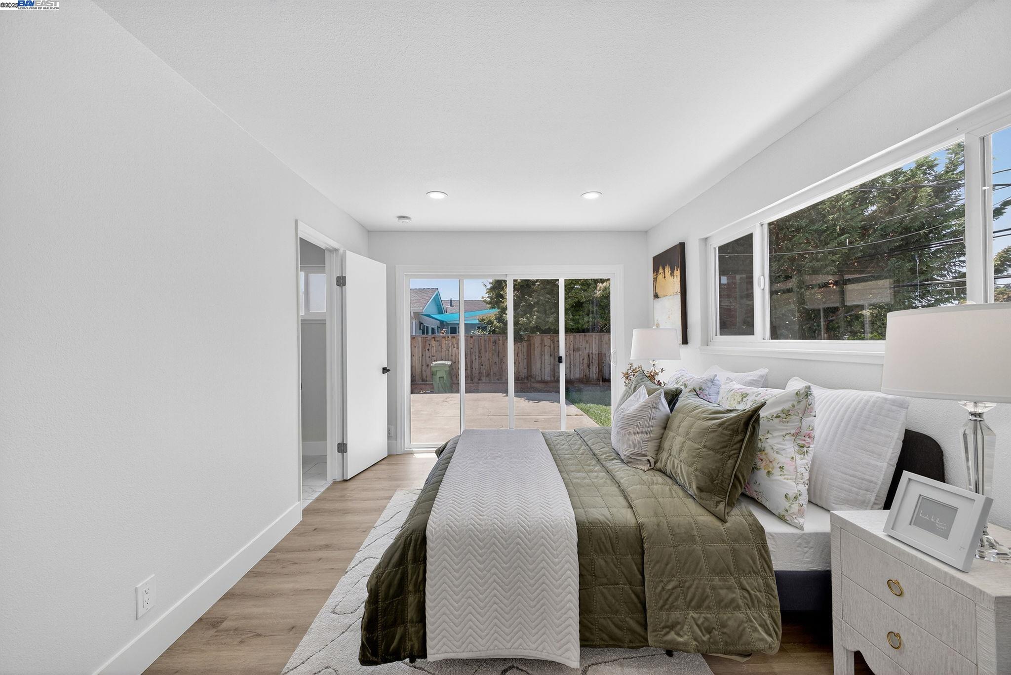 4403 Burke Way Fremont, CA 94536 - Photo 23 of 58 a bed room with a bed and a large window