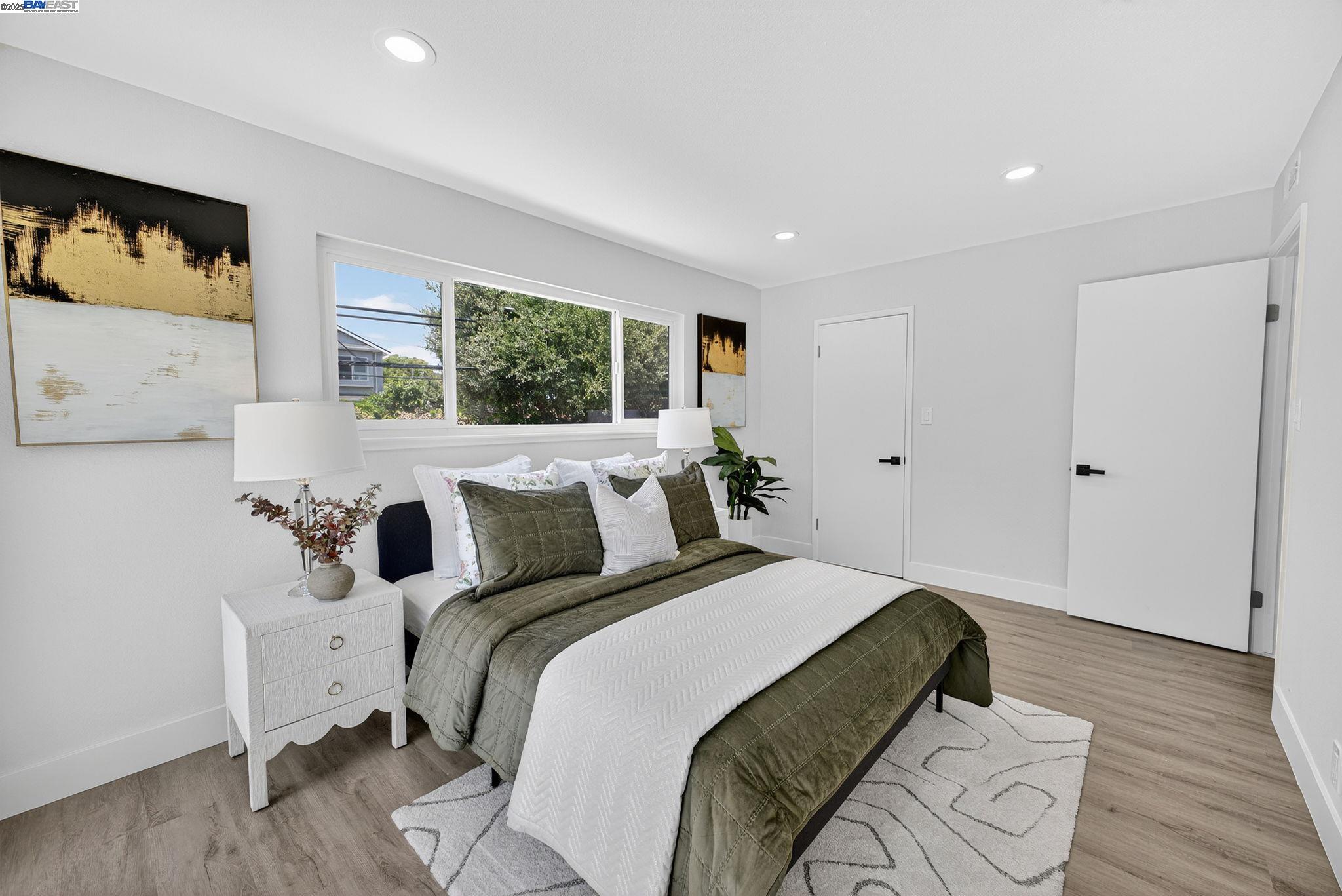 4403 Burke Way Fremont, CA 94536 - Photo 24 of 58 a bedroom with bed and wooden floor