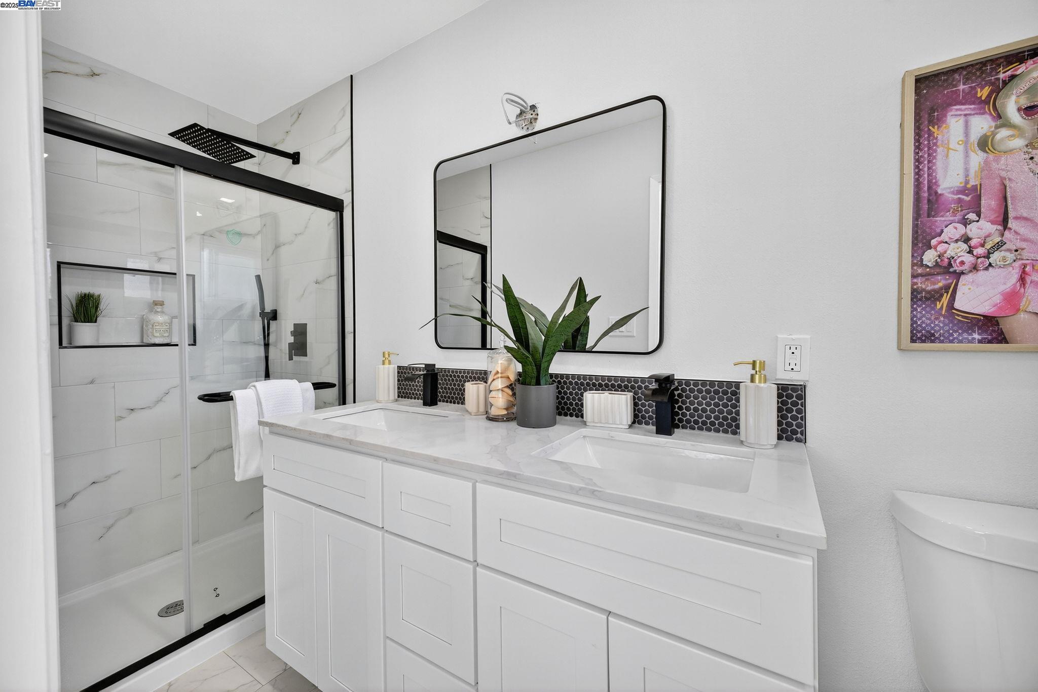 4403 Burke Way Fremont, CA 94536 - Photo 26 of 58 a bathroom with double vanity and a mirror