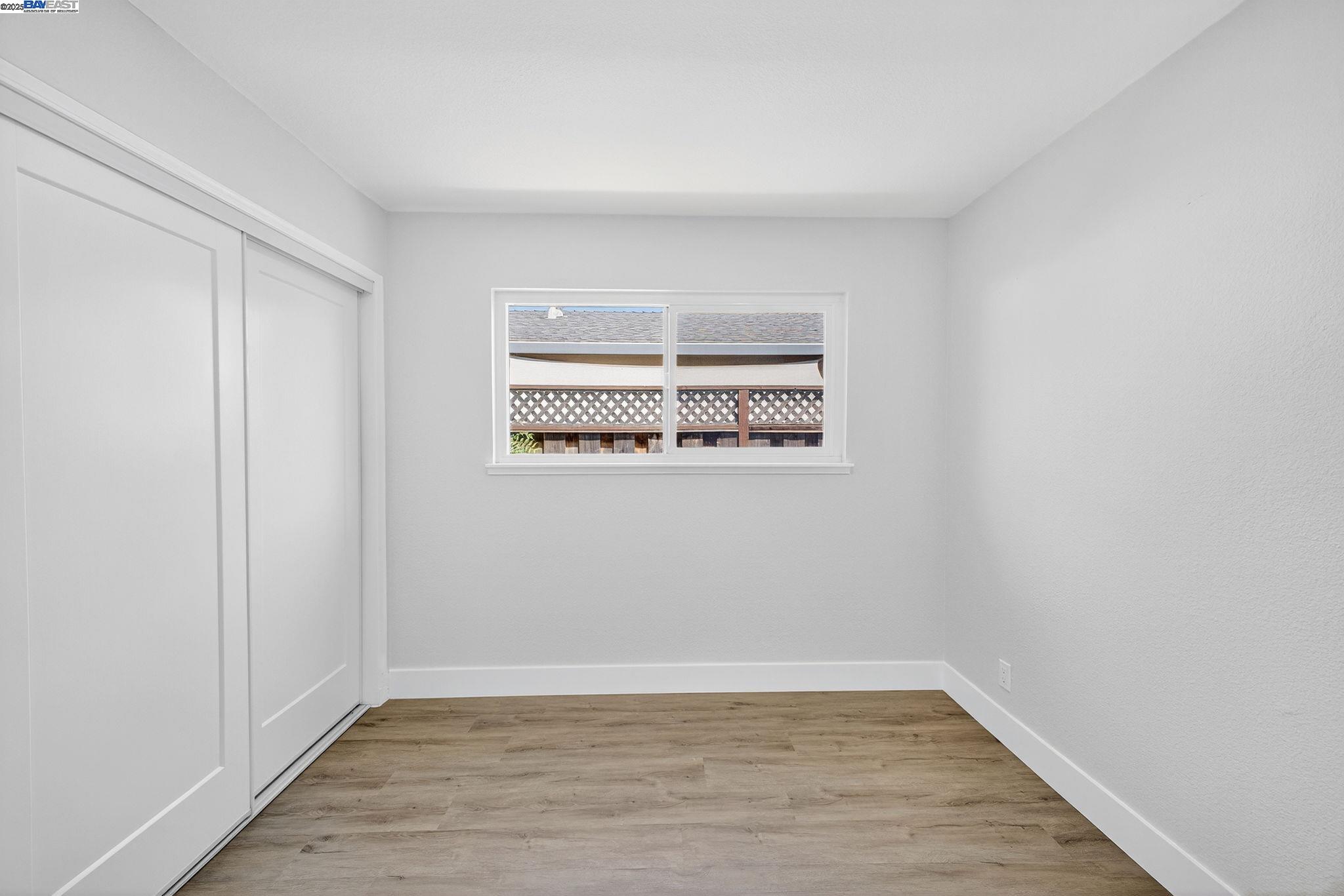4403 Burke Way Fremont, CA 94536 - Photo 31 of 58 a view of a room with wooden floor and a window