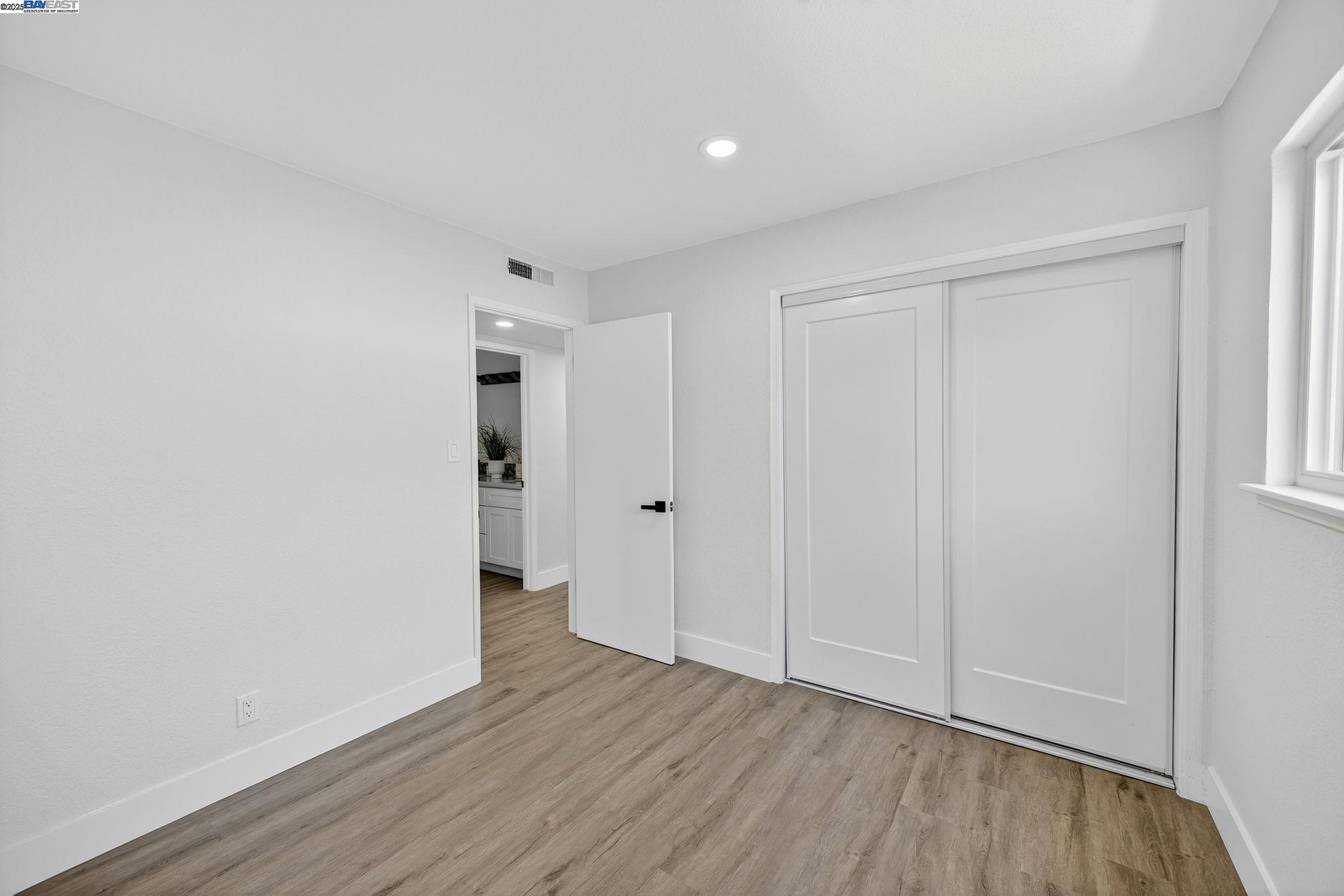 4403 Burke Way Fremont, CA 94536 - Photo 33 of 58 a view of an empty room with wooden floor
