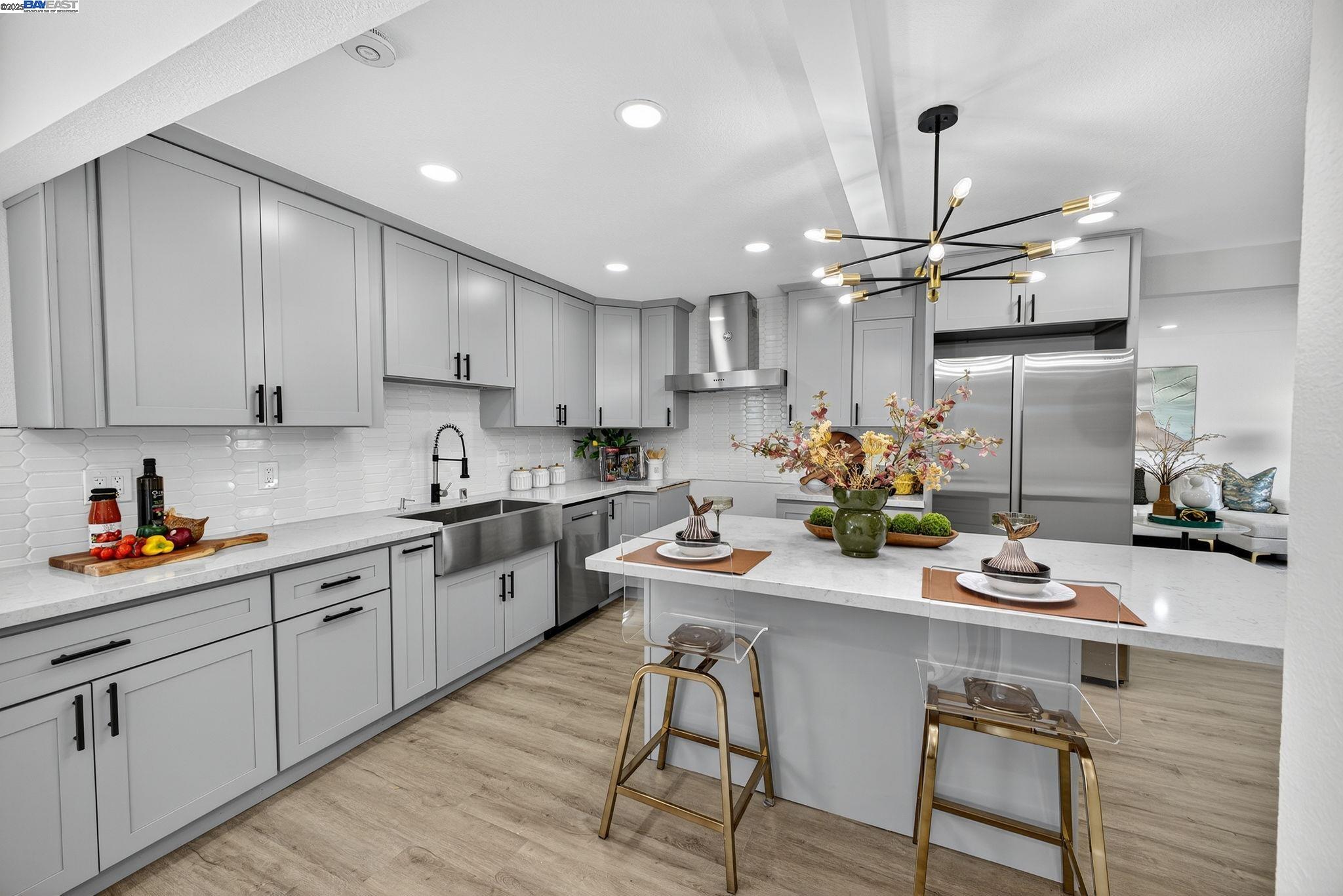 4403 Burke Way Fremont, CA 94536 - Photo 5 of 58 a kitchen with a sink cabinets and wooden floor
