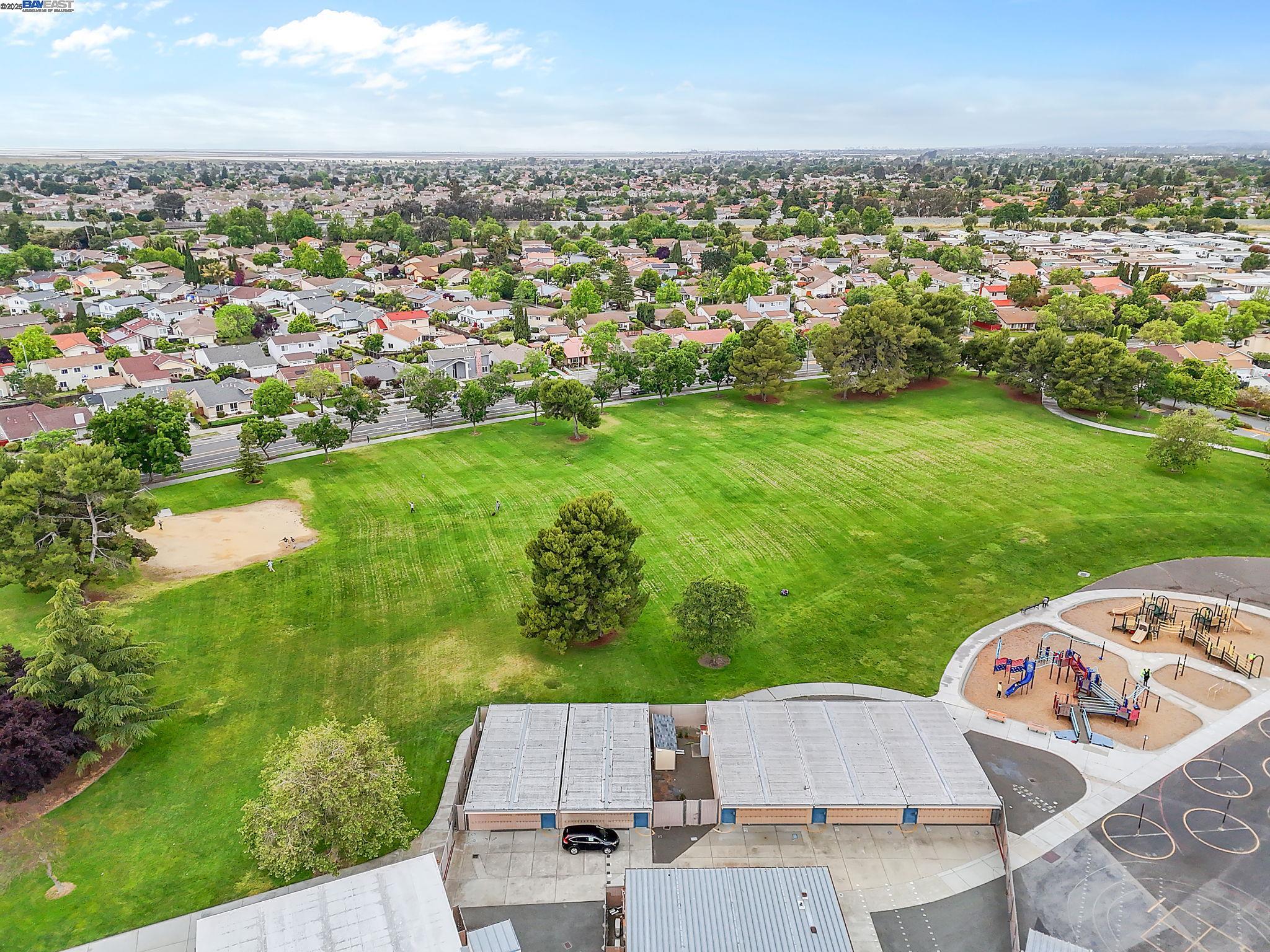 4403 Burke Way Fremont, CA 94536 - Photo 54 of 58 an aerial view of residential houses with outdoor space and trees
