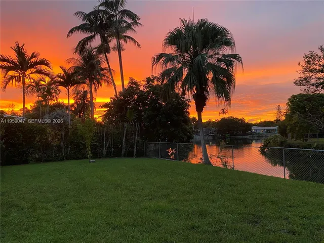 a view of lake with a house